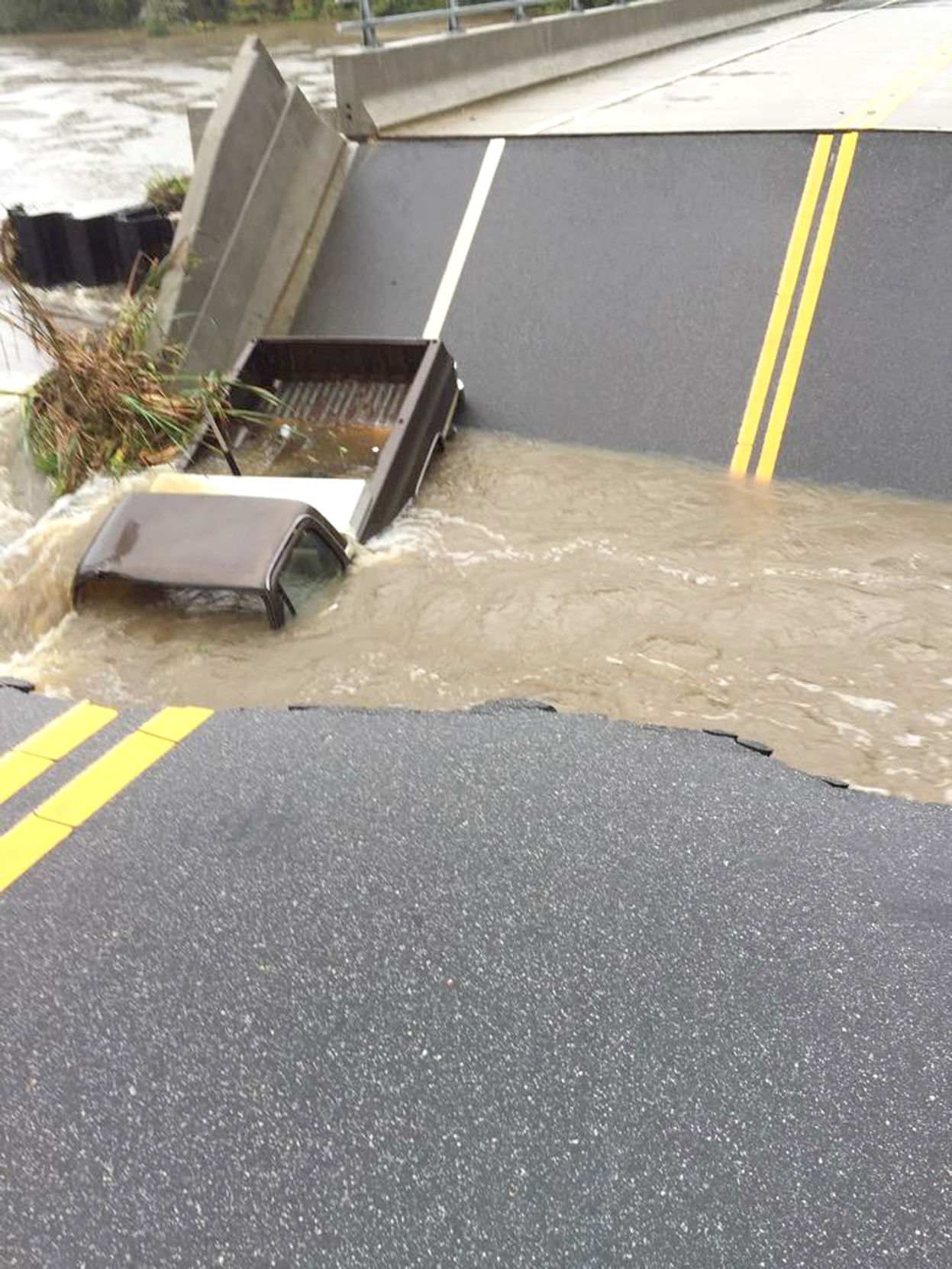 Flooding bridge collapse